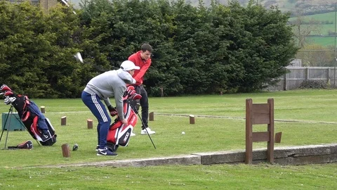Golf swing tee off filmed in High Definition Slow Motion Stock Footage 106464257