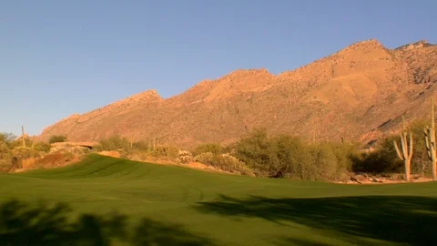 Golfcourse desert mountains at magic hour Arizona Stock Footage 125278554