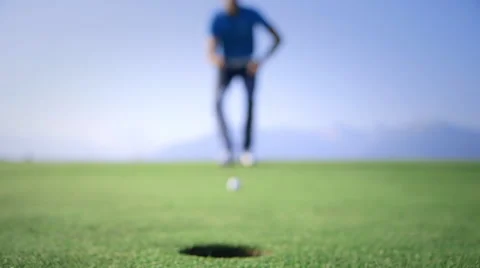 Golfer analyzing the trajectory and put Stock Footage 41472538