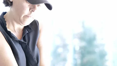 Golfer with Cap Making a Golf Swing Stock Footage 201061282