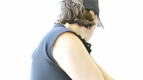 Golfer with Cap Making a Golf Swing on White Background Видео 201061320