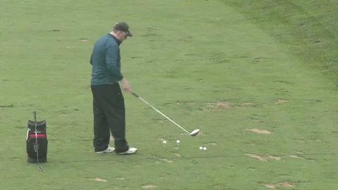 Golfer on Driver Range - Warming Up Stock Footage 79513337