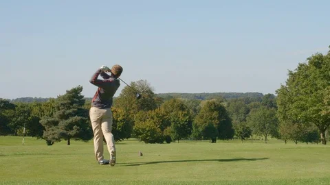 A Golfer drives in slow motion. Vídeo Stock 80419517