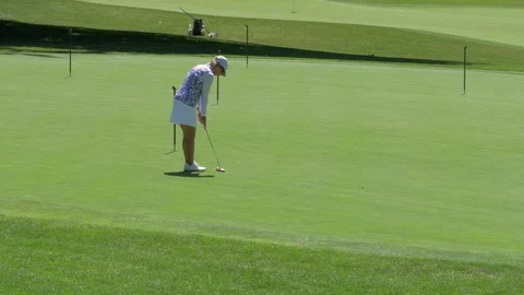 Golfer (female) practicing. Video stock 91078780