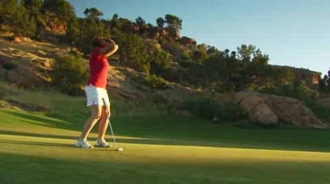 Golfer with golf club in course Video stock 54592425