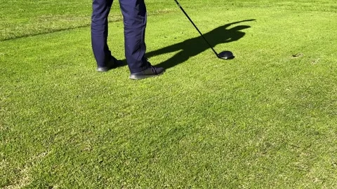 Golfer with His Shadow on the Grass on the Golf Course Warm Up His Arms Stockbeeldmateriaal 287212312
