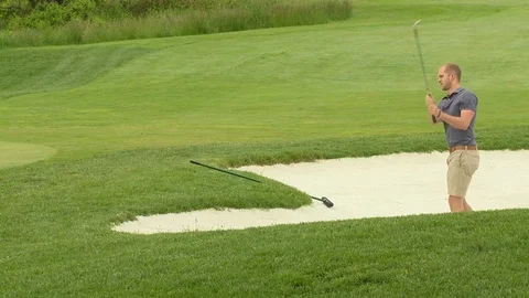 Golfer hits out of sand Stock Footage 74244826