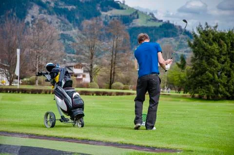 Golfer hitting ball Stock Photos