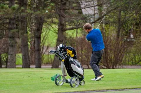 Golfer hitting ball Stock Photos