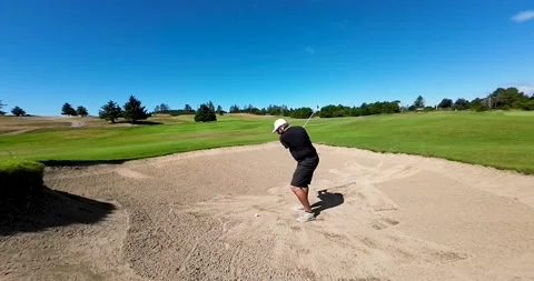 Golfer hitting a bunker shot Stock Footage 208887847