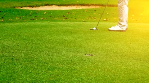 Golfer Hitting Golf Ball directly into Hole on Green Course Stock Footage 341824699