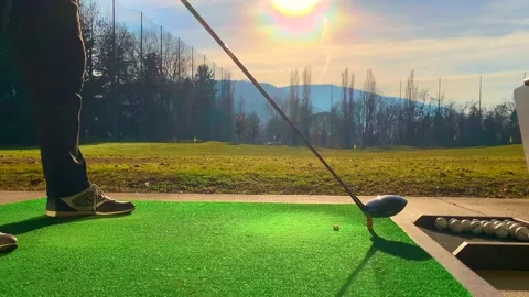 Golfer Hitting the Golf Ball with Driver on Mat in Driving Range 스톡 동영상 194011924