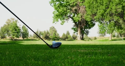 Golfer hitting a golf ball. Golf sports hobby healthy lifestyle Stock Footage 247442913