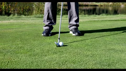 Golfer hitting an iron shot Stock Footage 162204855
