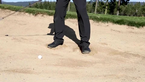 Golfer hitting a sand bunker shot Stock Footage 163256853