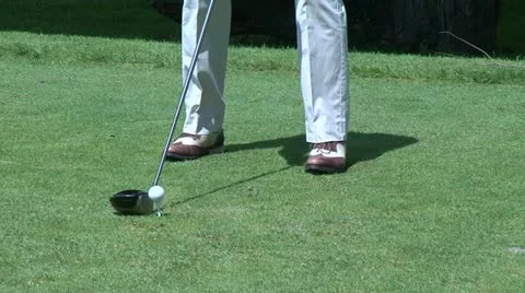 Golfer hitting a tee shot Stock Footage 22303572