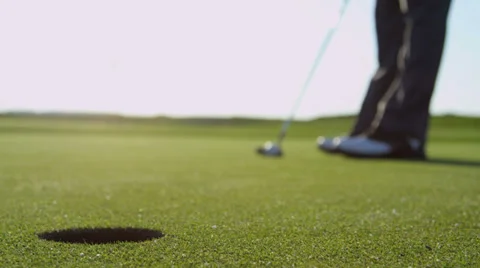 Golfer Holing Ball Using Putter Close Up Stock Footage 39888299