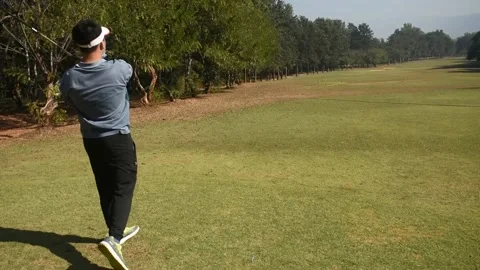 Golfer kicks the golf ball on the course Stock Footage 146466962