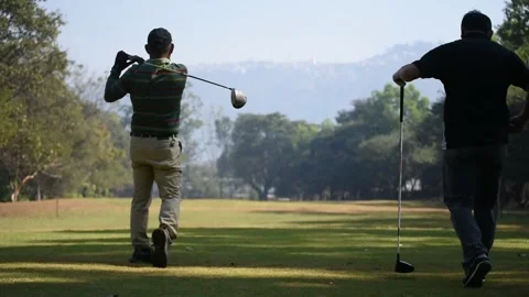 Golfer kicks the golf ball on the course Stock Footage 146467014