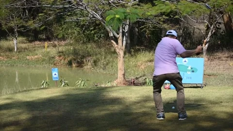 Golfer kicks the golf ball on the course Stock Footage 146468243