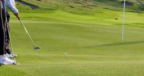 Golfer Lining Up a Putt on a Scenic Course Stock Footage 337723272