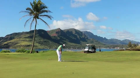 Golfer making 20 foot putt in hawaii Stock-Footage 48546750