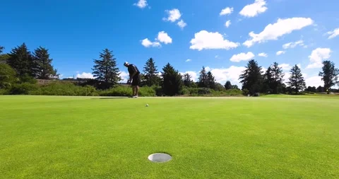 Golfer making a long putt Stock Footage 208887841
