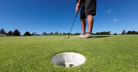 Golfer making a short putt Stock Footage 208887838