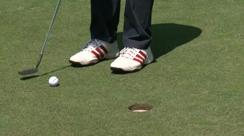 Golfer misses the hole Stock Footage 22303579