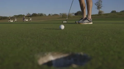 Golfer Missing the Hole with a Putt Stock Footage 141081620