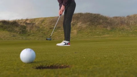 Golfer narrowly missing putt to the right Stock Footage 104563757