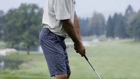 Golfer performing a golf swing on course in slow motion Stock Footage 71544426