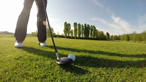 Golfer performs a golf shot from the fairway. Stock Footage