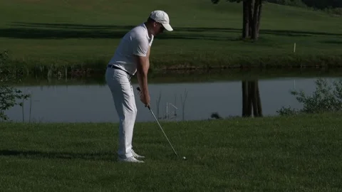 Golfer performs a golf shot from the fairway. Video stock 95131733