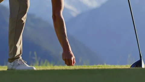 Golfer placing ball on tee before driver shot Video stock 337009853