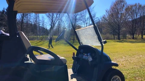Golfer Playing on Golf Course with His Golf Cart. Stockbeeldmateriaal 111309436