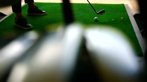 Golfer Practice Golf Swing in Driving Range and with a Golf Bag with Golf Club Видео 161220686