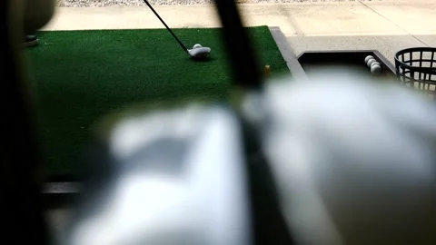 Golfer Practice Golf Swing with Her 3 Wood in Driving Range and a Golf Bag Vídeo Stock 191951998