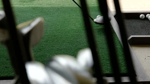 Golfer Practice Golf Swing with Her Driver in Driving Range and a Golf Bag Stock-Footage 191952050
