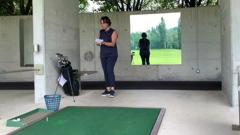 Golfer Preparation to Practicing Golf Swing in Driving Range 動画素材 194011562