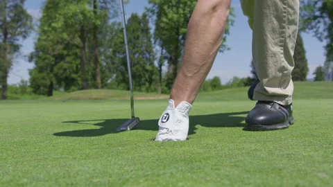 Golfer Pulls Out Ball From Hole In Green 스톡 동영상 210218044