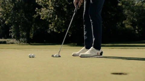 Golfer is putting the ball not inside the hole Stock Footage 220293084