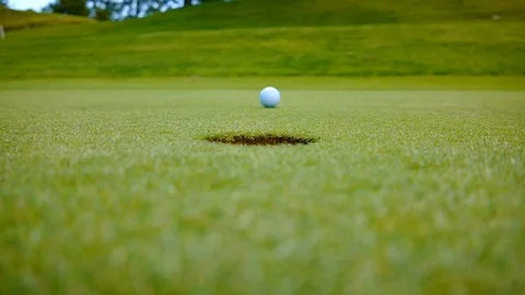 Golfer Putting the Golf Ball on the Green Stockbeeldmateriaal 112321753