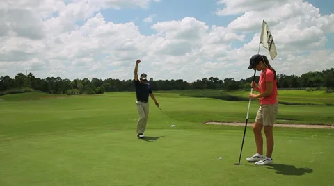 Golfer putting on green miss Stock Footage 36764703