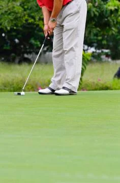 Golfer putting Stock Photos