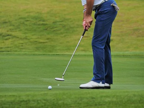 Golfer putting Stock Photos