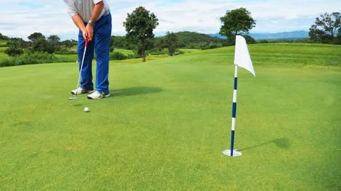 Golfer putting Stock Photos