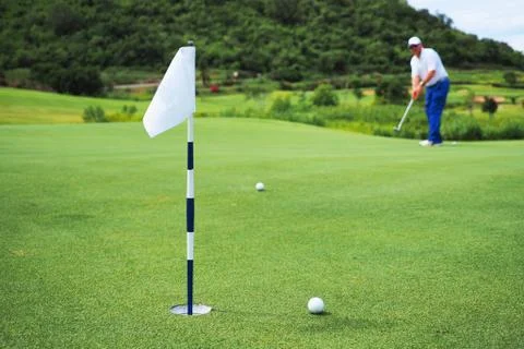 Golfer putting Stock Photos