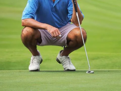 Golfer putting Stock Photos