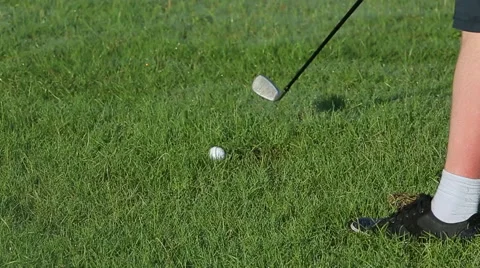 Golfer putting, selective focus on golf ball Video stock 66372499
